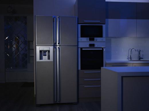A refrigerator in a kitchen during a power outage.